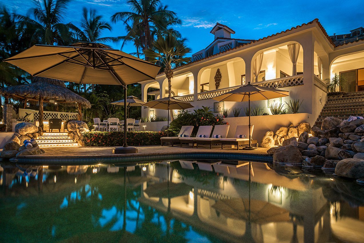 Casa Edwards estate and pool lit at dusk