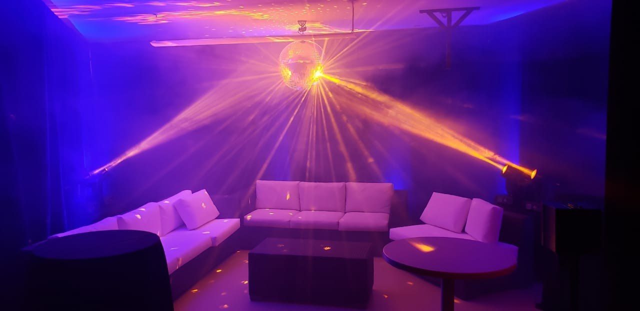 Villa gym turned into a night club with disco ball and lasers