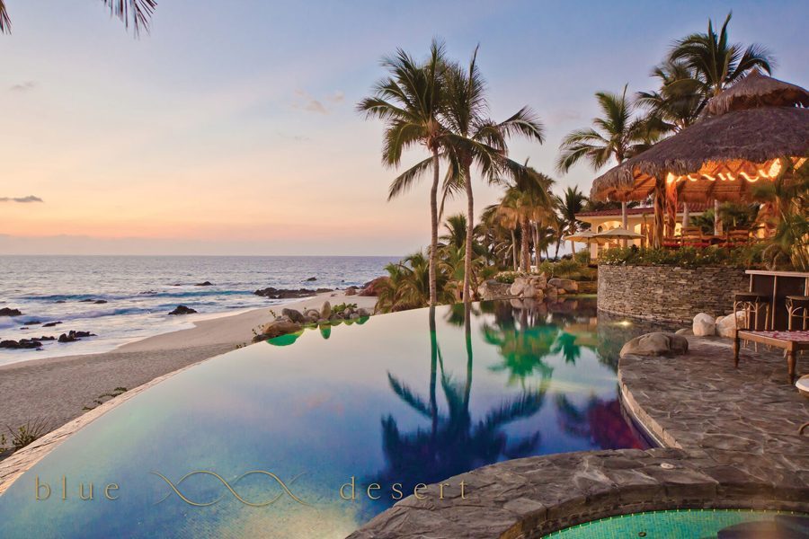 Casa Captiva infinity pool above the beach at sunset